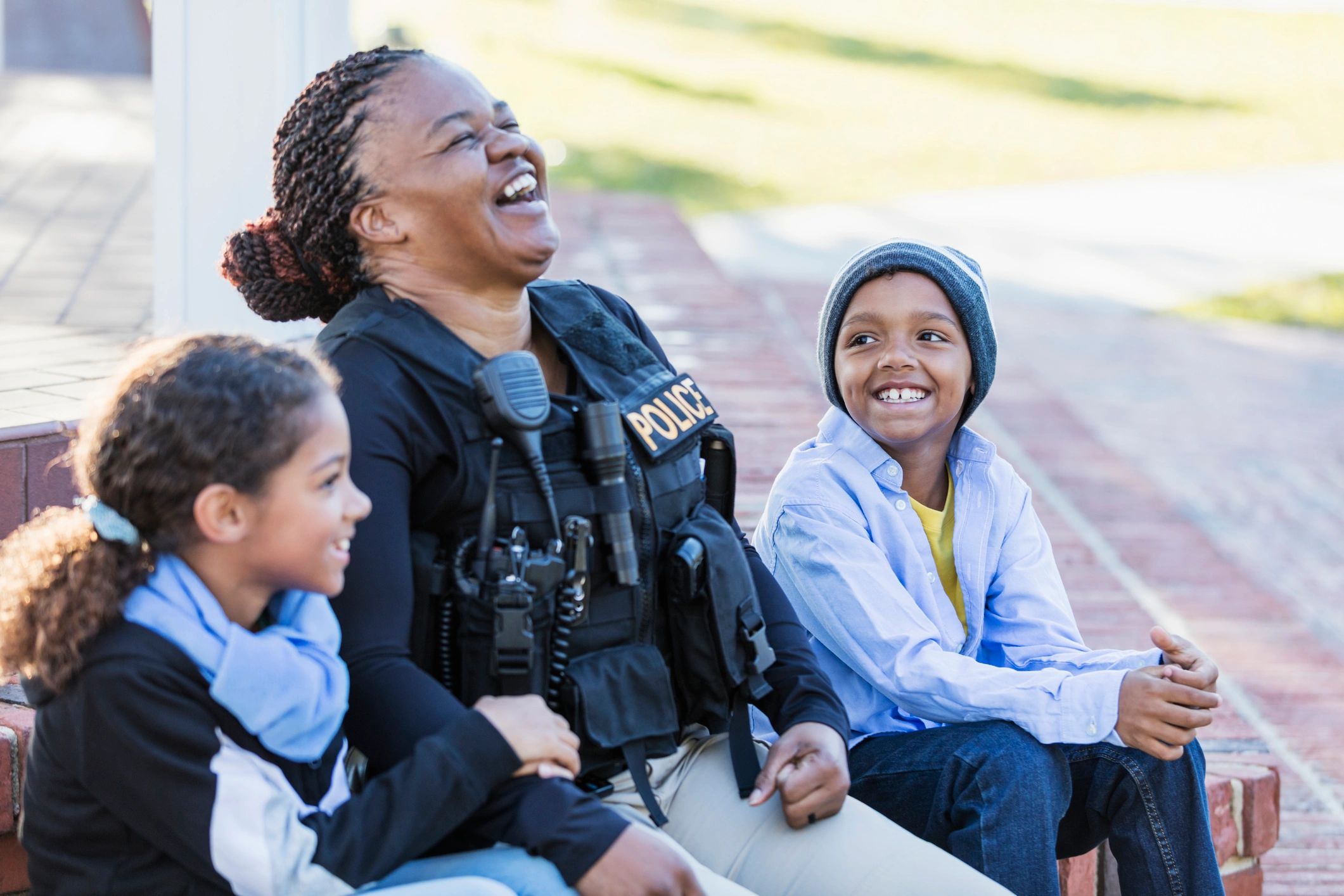 Police officer speaking with children during a community outreach event
